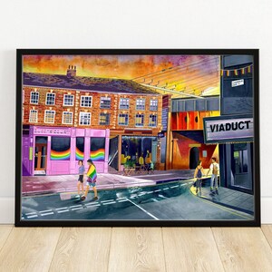 May include: A watercolour painting of a street scene with a pink building with rainbow flags in the windows. The building has the text "The Old Crown" above the windows. There is a sign on the building to the right that says "VIADUCT".