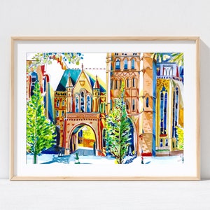 May include: A watercolor painting of a colorful building with a large archway. The building is surrounded by trees and has a white background. The building has a red roof and yellow walls. The archway is made of brick and has a stone arch. The trees are green and have brown trunks. The painting is framed in a light wood frame.