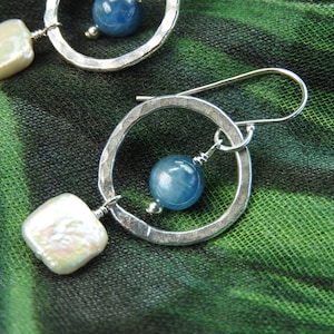 Fine silver hoop earrings with kyanite rounds and freshwater pearl squares. Dangle earrings feature fine silver, kyanite & freshwater pearls