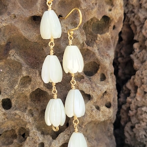 A trio of mother of pearl pikake earrings. Wire-wrapped Hawaiian jasmine beads.