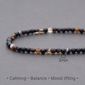 Puede incluir: Pulsera de ágata negra y marrón con cuentas de 3 mm.
