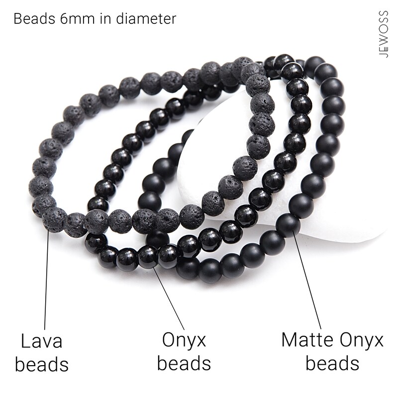 May include: Three black beaded bracelets, one made of lava beads, one of onyx beads, and one of matte onyx beads. Beads 6mm in diameter.