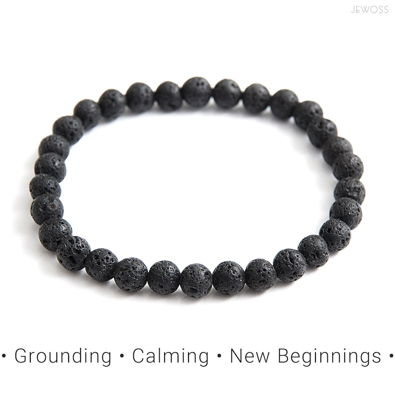 May include: Black lava rock beaded bracelet. The bracelet is made of small, round beads that are strung together on a stretchy cord. The beads are a dark gray color and have a rough, textured surface.