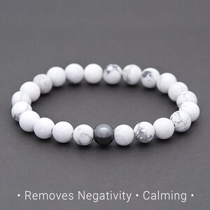 May include: White Howlite beaded bracelet with a single black Hematite bead. Removes Negativity. Calming.