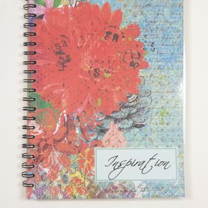 May include: A spiral bound notebook with a colorful floral design and the word "Inspiration" on the front cover.