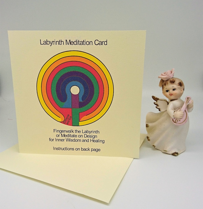 May include: A yellow card with a rainbow colored labyrinth design. The text "Labyrinth Meditation Card" is at the top of the card. The text "Fingerwalk the Labyrinth or Meditate on Design for Inner Wisdom and Healing" is below the labyrinth. The text "Instructions on back page" is at the bottom of the card.
