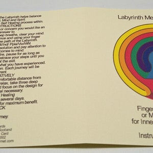 May include: A yellow card with a rainbow colored labyrinth design. The card has text that reads "Labyrinth Meditation Card" and "Fingerwalk the Labyrinth or Meditate on Design for Inner Wisdom and Healing". The back of the card has instructions on how to use the labyrinth.
