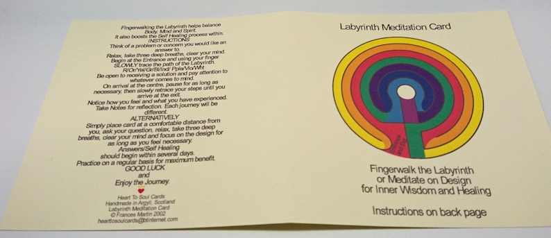 May include: A yellow card with a rainbow colored labyrinth design. The card has text that reads "Labyrinth Meditation Card" and "Fingerwalk the Labyrinth or Meditate on Design for Inner Wisdom and Healing". The back of the card has instructions on how to use the labyrinth.