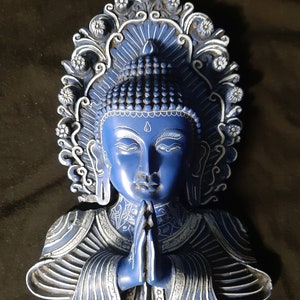 Buddha mask made of resin. Made in Nepal.