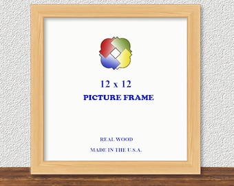 May include: A square 12 x 12 inch picture frame made of real wood. The frame is light brown and has a white interior. The text "PICTURE FRAME" is displayed in blue, with the text "REAL WOOD" and "MADE IN THE U.S.A." below it.