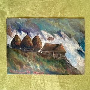 May include: A painting of a rural landscape with three haystacks and a small wooden house. The sky is painted in shades of blue, purple, and white, with fluffy clouds. The haystacks are brown and the house is a dark brown with a white roof. The painting is signed "Alex x 36 Bez"