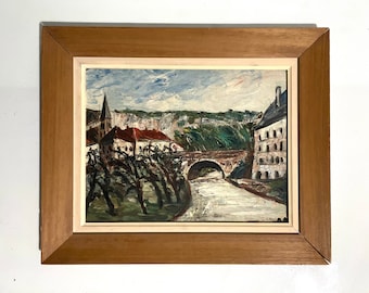 1930s French oil painting on panel. Village view in France with bridge and river.