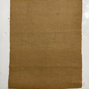May include: A piece of brown burlap fabric with a woven texture.