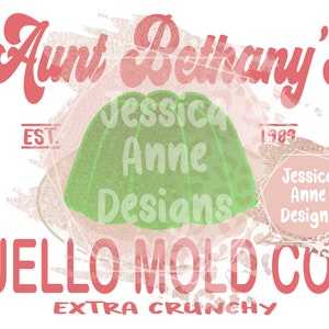May include: A pink and green graphic design with the text "Aunt Bethany's Jello Mold Co. Extra Crunchy" and the text "Jessica Anne Designs" in a pink circle.