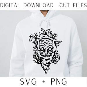 以下が含まれることがあります： 蔦と葉でできたあごひげと髪を持つ、スタイリッシュな顔を描いた白黒のデジタルダウンロードのグラフィックデザイン。デザインは白いパーカーに施されています。デザインの下には「SVG + PNG」というテキストがあります。