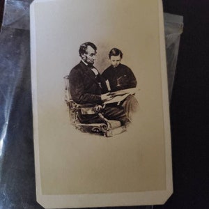 Abraham Lincoln and Son Tad Reading carte-de-visite