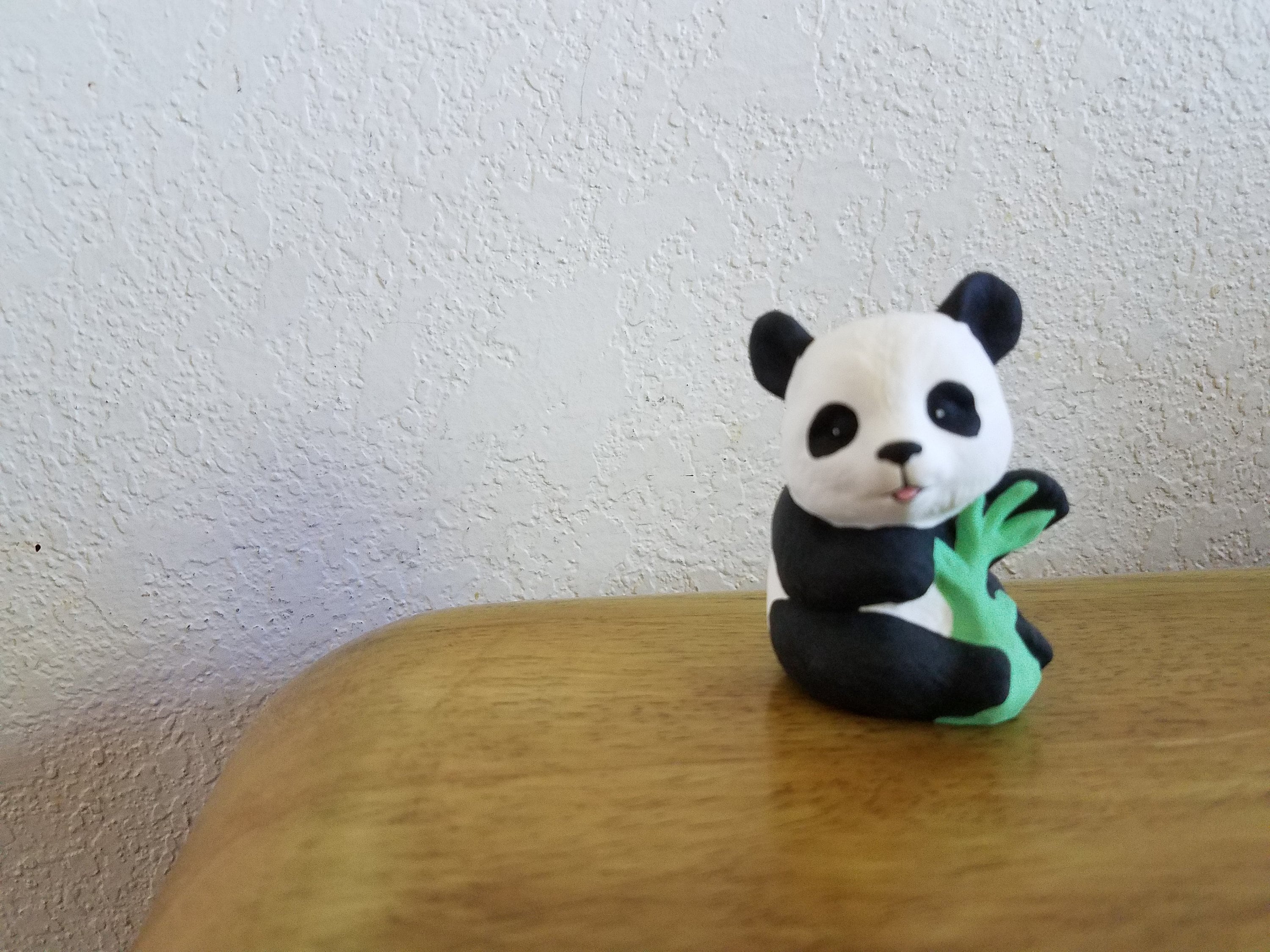 Ceramic Small Panda Bear Sitting Holding Bamboo 1107