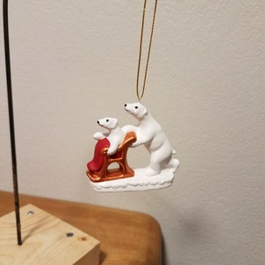 Ceramic Mama Bear pushing Baby bear in sled (#850)