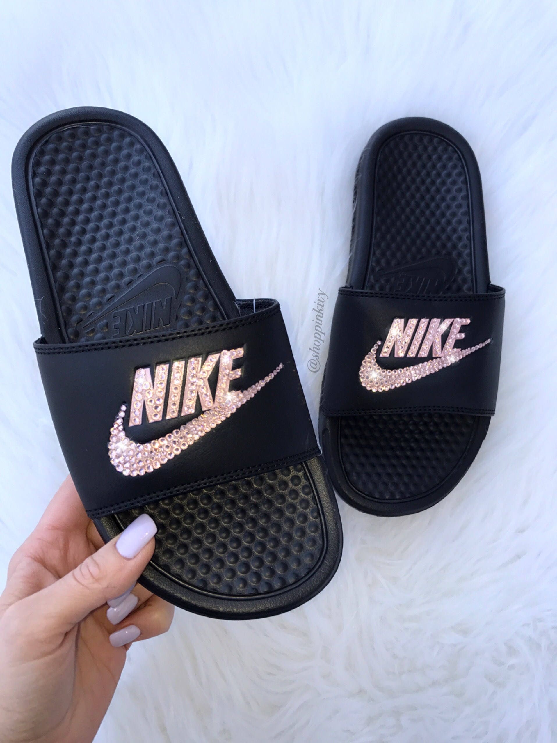black red and gold nike slides