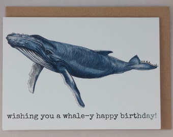 May include: A greeting card with a blue whale illustration and the text "wishing you a whale-y happy birthday!"