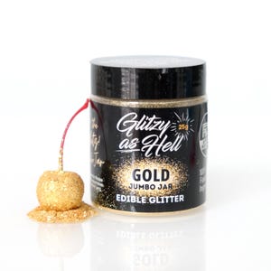 May include: A jar of gold edible glitter labeled "Glitzy as Hell Gold Jumbo Jar Edible Glitter" with a 25g size.