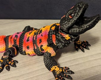 Monstre de Gila mobile imprimé en 3D avec la bouche qui s'ouvre