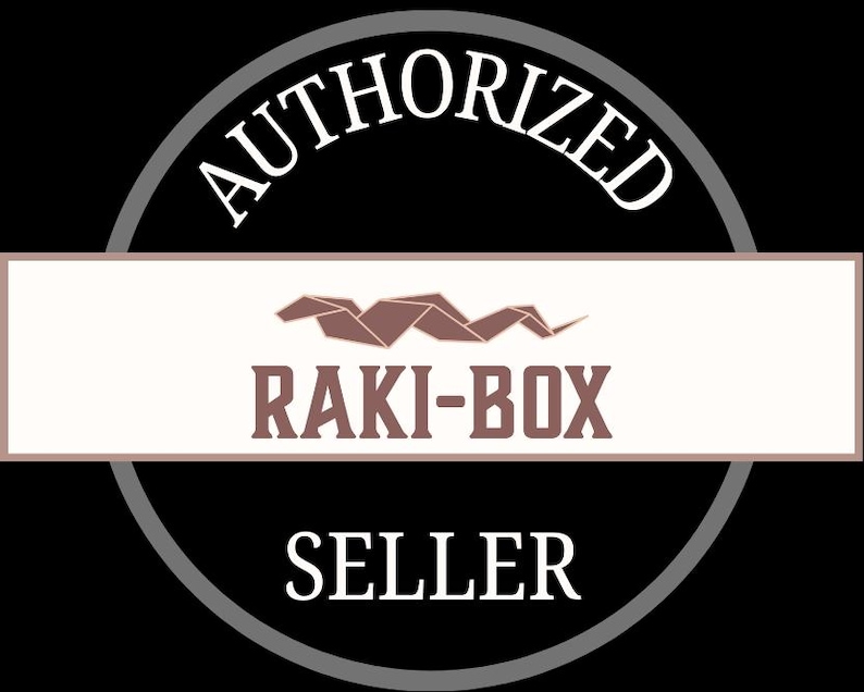 May include: A black and white graphic with the words "AUTHORIZED SELLER" in white, encircling a rectangular banner. The banner contains the text "RAKI-BOX" in brown, with a brown origami-style design above it.