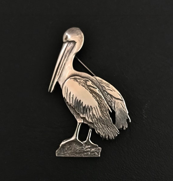Pelican brooch best sale