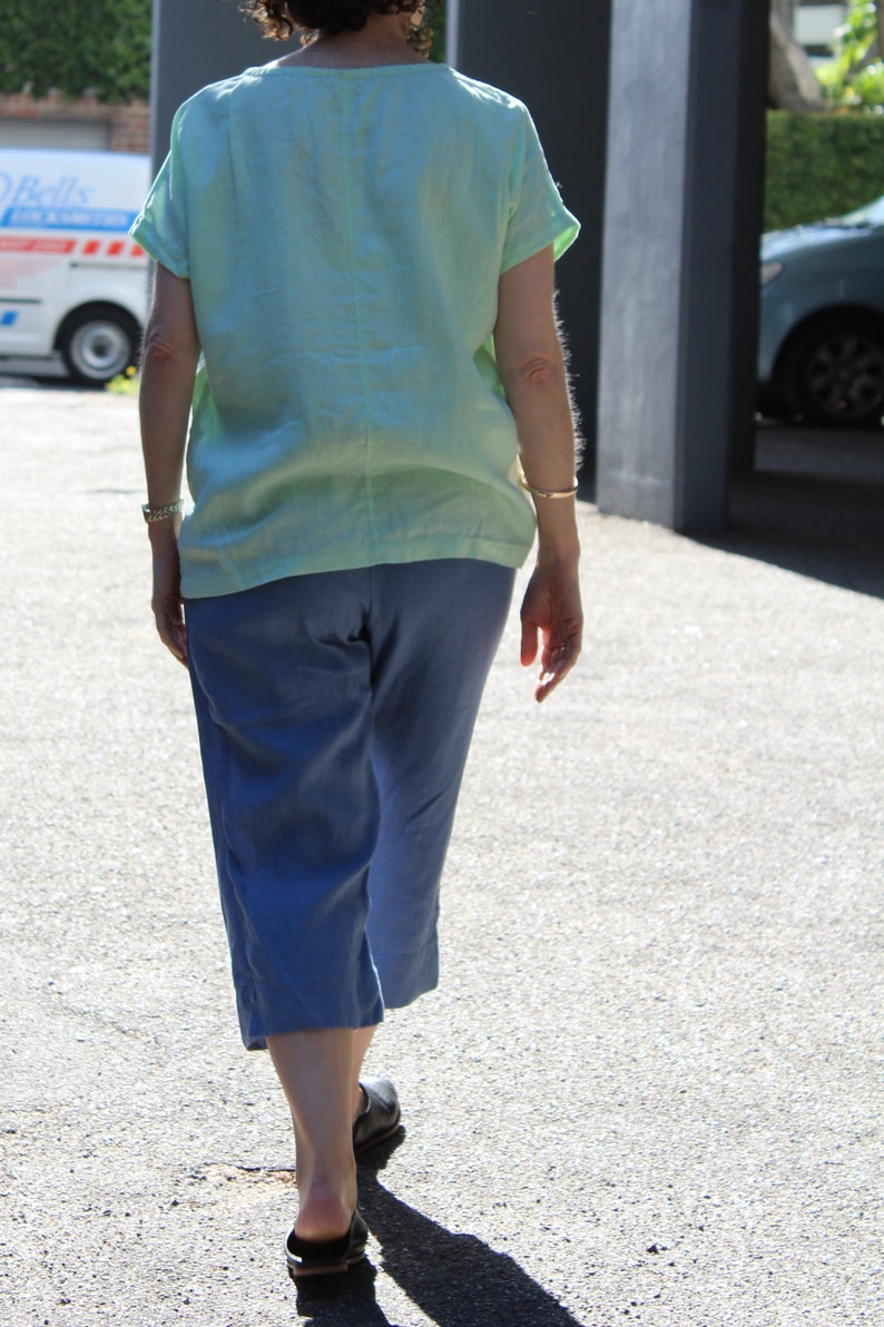 Womens wide shoulder 100/% Linen tee with angled patch pocket Light Green