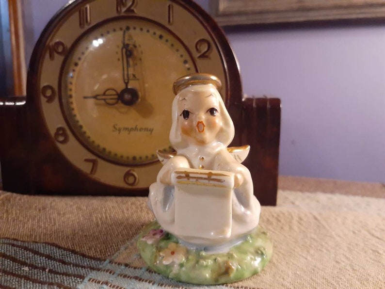 Free Shipping USA Vintage Choir Angel Singing and Holding Music Standing in Green Grass and Flowers
