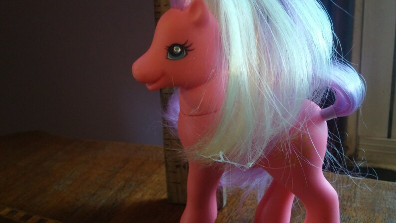 My Little Pony Pink With Purple And Yellow Hair And Sun On Side