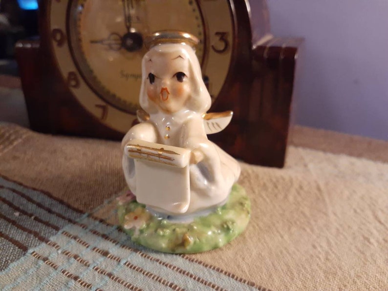 Free Shipping USA Vintage Choir Angel Singing and Holding Music Standing in Green Grass and Flowers