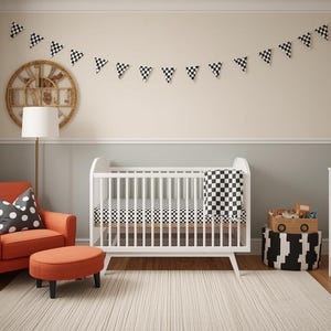 May include: A nursery with a race car theme. The room features a white crib, orange armchair, and a dresser. Checkered flags and patterns are used throughout the room, including on the curtains, bedding, and decorative accents.