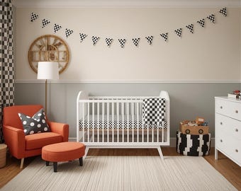May include: A nursery with a race car theme. The room features a white crib, orange armchair, and a dresser. Checkered flags and patterns are used throughout the room, including on the curtains, bedding, and decorative accents.