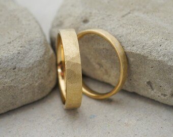 Hammered sustainable gold wedding rings in a square profile