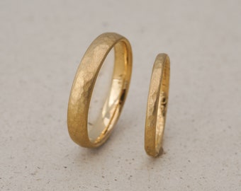 Yellow gold wedding rings with a fine hammer finish