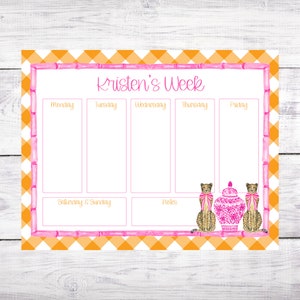 May include: A weekly planner with a pink and orange gingham border and a bamboo design. The planner has spaces for each day of the week, including Saturday and Sunday, and a notes section. The text "Kristen's Week" is at the top of the planner. Two cheetah illustrations are on the bottom right of the planner.