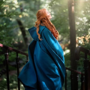 Blue-green hooded cape