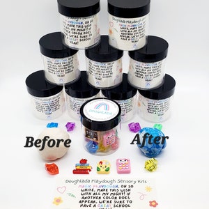 May include: A set of eight clear plastic containers with black lids filled with white playdough. The containers are stacked in a pyramid shape. The containers have a label that reads "Doughlada Playdough Sensory Kits" and "Magic Playdough. Oh so white, make this wish with all my might! If another color does appear, we're sure to have a great school year!"