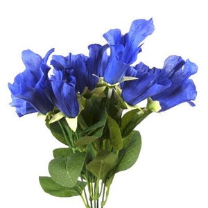 May include: A bouquet of blue artificial flowers with green leaves. The flowers are shaped like bells and have a delicate, realistic appearance.