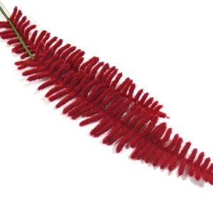 May include: A single red artificial fern sprig with a green stem.