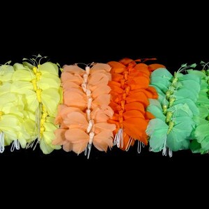 May include: A set of five butterfly-shaped fabric embellishments in various colors, including yellow, orange, peach, and green. The embellishments are made of soft, layered fabric and have a delicate, feminine look.