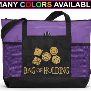 May include: Purple tote bag with black accents and mesh side pockets. The bag has a gold design of dice with the text "Bag of Holding".