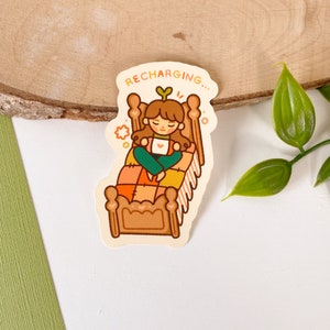 Rechargeing Girl - Sticker vinyle mat | Art numérique, autocollants, papeterie, kawaii, lit, relax, mignon, couverture
