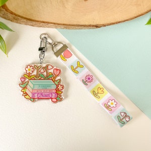 Boeken en bloemen - sleutelhanger met sleutelkoord | Digitale kunst, stickers, illustratie, kawaii, briefpapier, boekenliefhebber, boekenwurm, bloemen, madeliefje, tulp