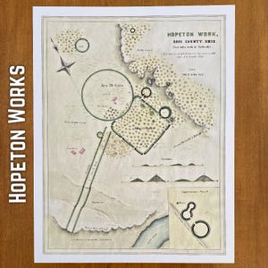May include: A vintage map print of Hopeton Work in Ross County, Ohio. The map features detailed illustrations of the area, including a large circular structure labeled "Area 20 Acres" and other geometric shapes. The print has a sepia tone with green and pink accents.