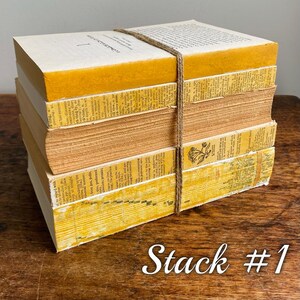 May include: A stack of vintage books with yellowed pages and brown covers, tied together with twine. The books are stacked on a wooden surface. The text on the top book reads "Commonwealth Literature".