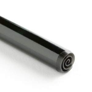 May include: A black, cylindrical pen with a spiral tip. The pen is made of a smooth, shiny material.