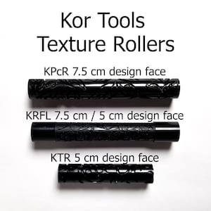 May include: Three black texture rollers for crafting. The rollers are labeled with their size and design face: KPCR 7.5 cm design face, KRFL 7.5 cm / 5 cm design face, and KTR 5 cm design face.
