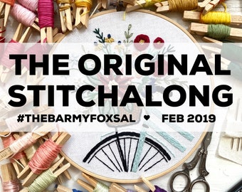 May include: A close-up of an embroidery hoop with a black and white bicycle design, surrounded by colorful embroidery floss and wooden clothespins. The text "THE ORIGINAL STITCHALONG #THEBARMYFOXSAL ♥ FEB 2019" is displayed above the hoop.